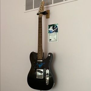 Guitar signed by Miley Cyrus